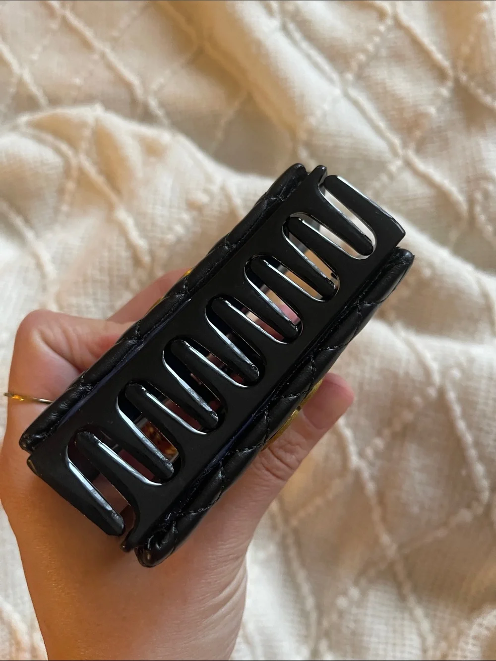 CHANEL Black Quilted Leather Hair Clip with Gold CC Emblem